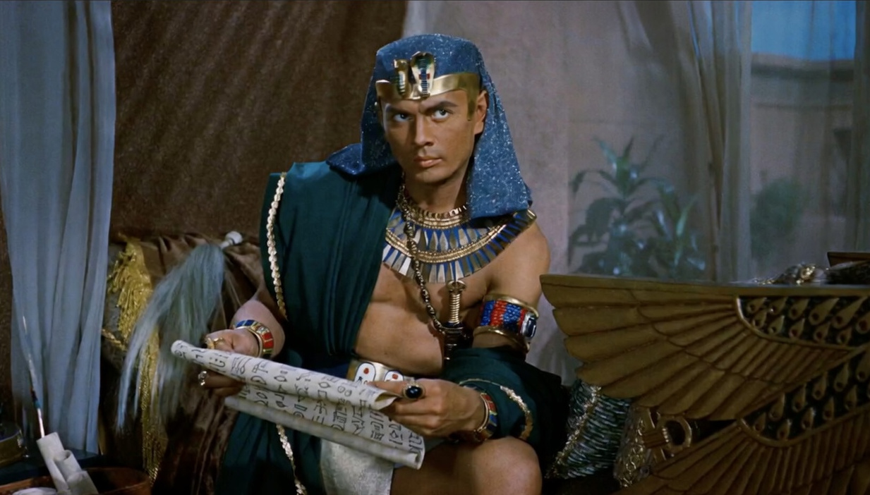 Yul Brynner as Rameses, holding a scroll, in The Ten Commandments